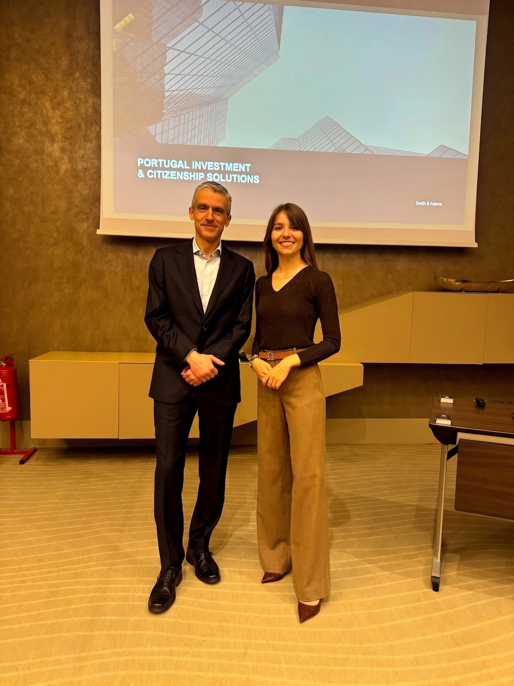 José Gaspar and Inna Statova in front of a Portugal investment and citizenship presentation